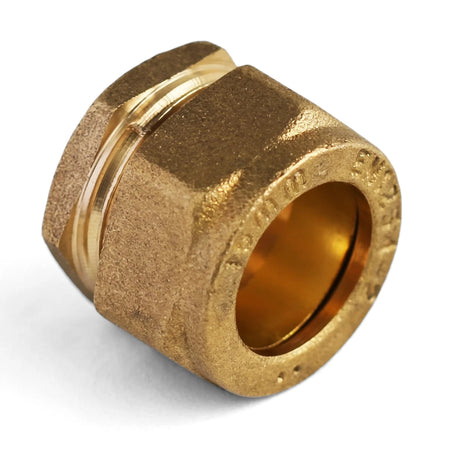 15mm brass compression stopend plumbing fitting for pipe connection, viewed at a slight angle.