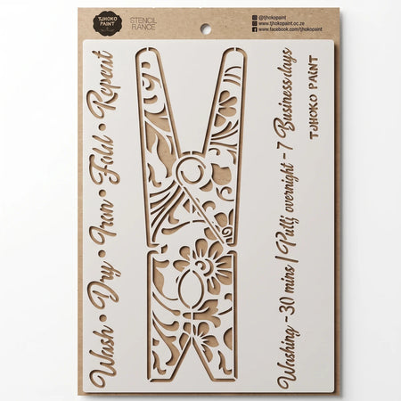 2022-A4-3 paint stencil featuring a large clothesline pin design with intricate floral patterns on a light brown cardboard