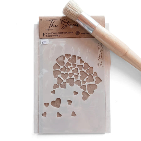 2022-A6-6 Paint Stencil with a heart pattern, packaged with a wooden stencil brush on a patterned surface.