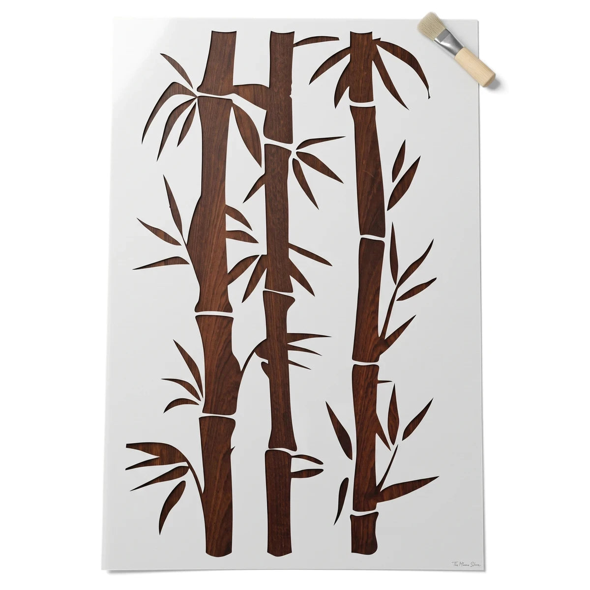 White 22-90X60-1 paint stencil featuring a bamboo stalk and leaf design, accompanied by a small application brush.