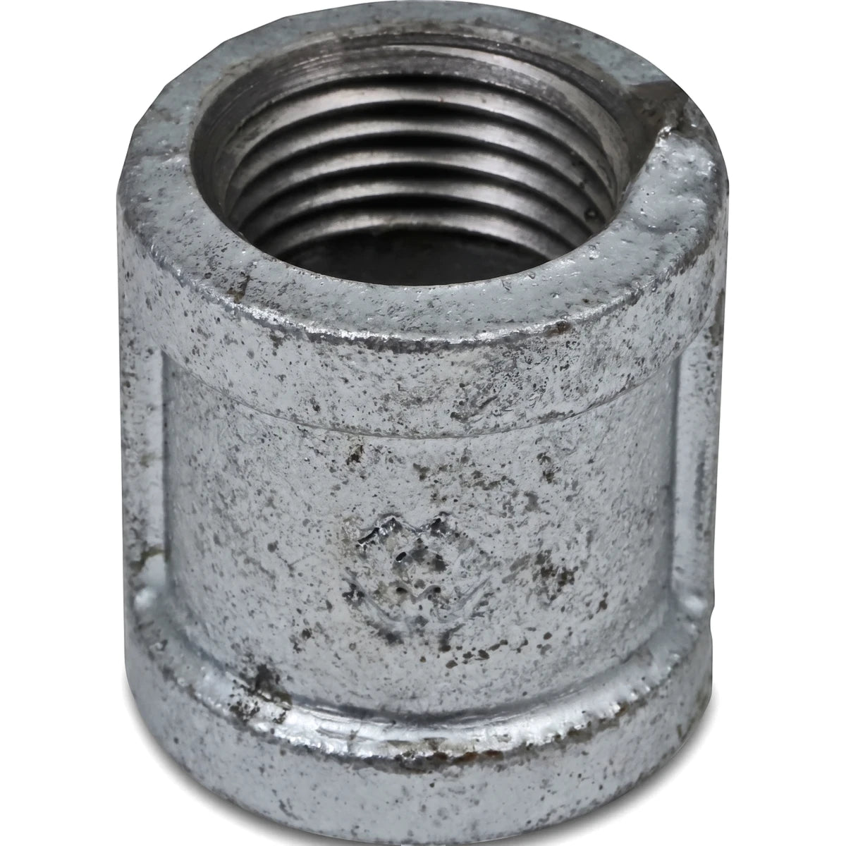 Close-up view of a 3/4 inch galvanized metal pipe socket with internal threading and a textured finish.