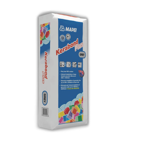 grey Kerabond Plus tile adhesive bag by Mapei, upright with blue panel and colourful mosaic accent