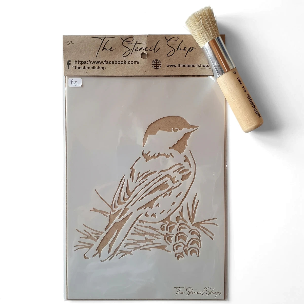 A5-32 Stencil 52 Paint Stencils with a bird and pinecone design, accompanied by a stencil brush on a surface.