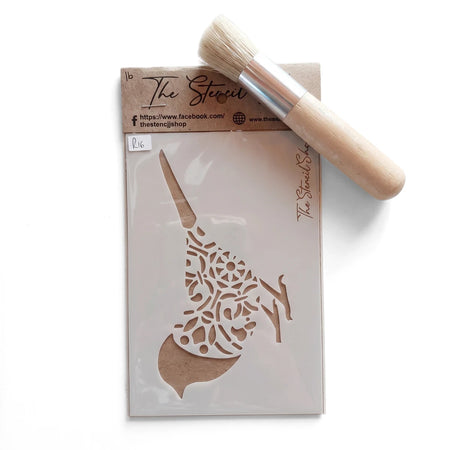 A white plastic A6-16 Stencil 11 paint stencil with an intricate design, packaged with a brown cardboard header, alongside a