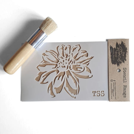 A6-27 Stencil 22 paint stencil featuring a large flower design, accompanied by a wooden handled stenciling brush.