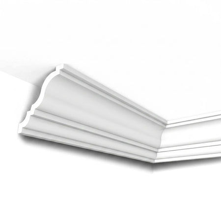 White Alina Cornice, an intricate decorative crown molding, installed in a room corner, showcasing its detailed profile.