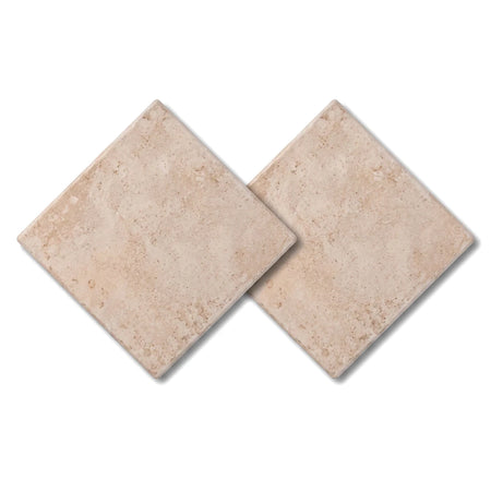 Two Athena Ochre square tiles displayed diagonally, showcasing their subtle textured surface and warm beige color.