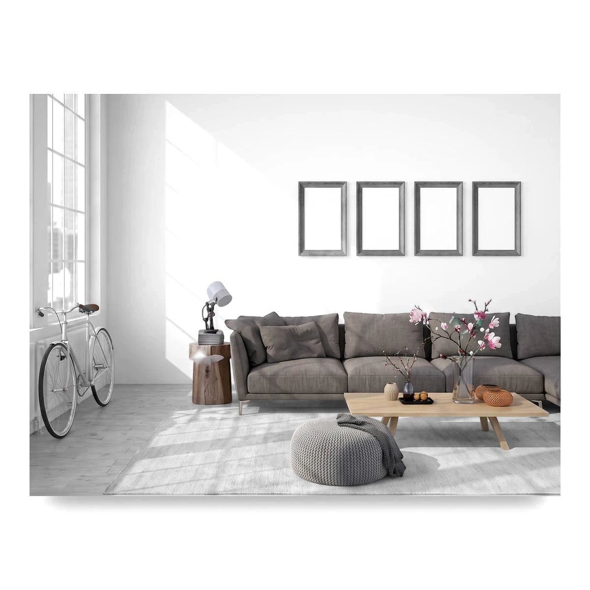 Barnes Almond 25x50cm tiles in a modern living room with a gray sofa, coffee table, and bicycle near a window.
