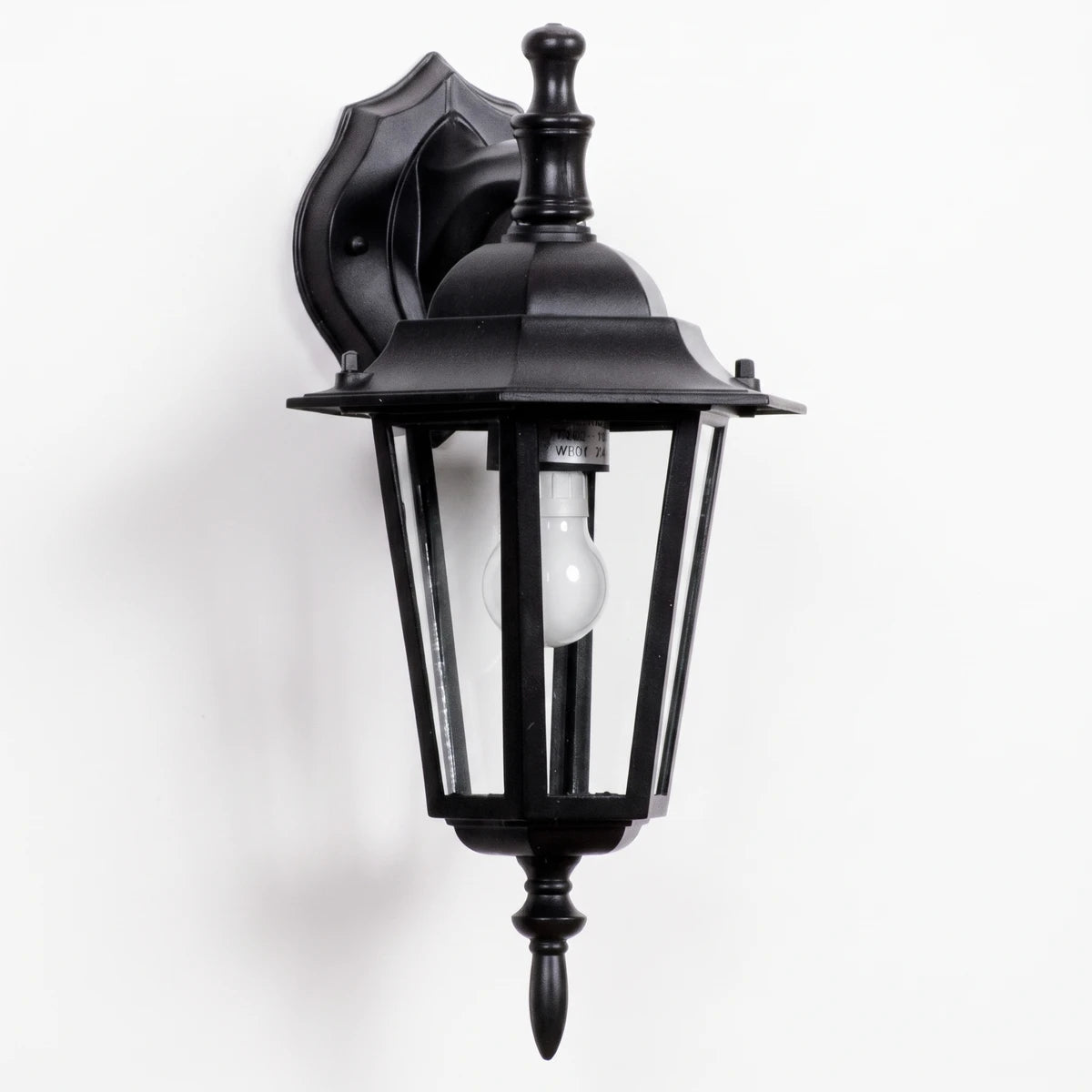 Black 6-panel downward-facing die-cast aluminum exterior wall light with a decorative mount and exposed bulb.