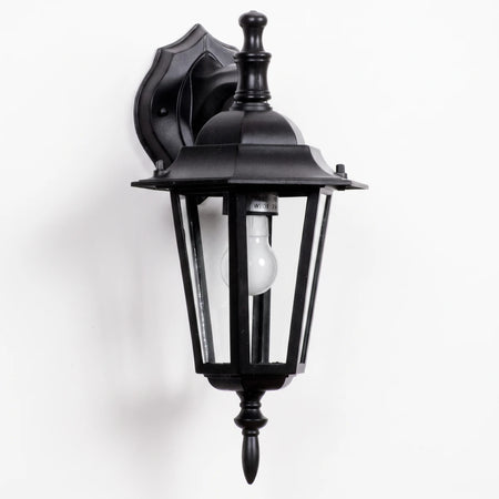 Black 6-panel downward-facing die-cast aluminum exterior wall light with a decorative mount and exposed bulb.