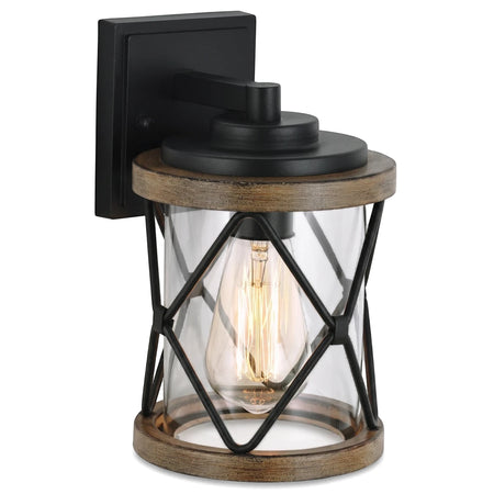 Black aluminum and wood-look exterior wall light with clear glass cylinder and criss-cross cage, featuring an Edison bulb.
