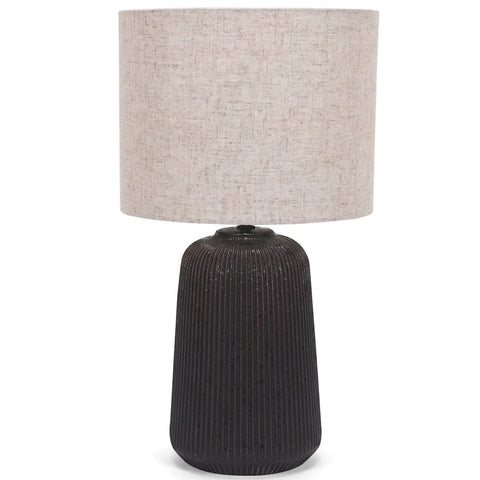 Black ceramic base table lamp with a textured vertical ridged base and a natural hessian fabric shade.