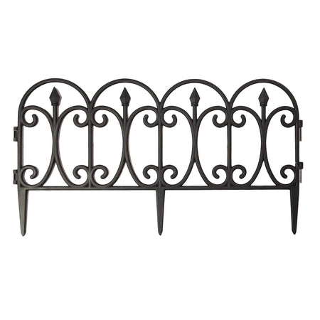 Black curved plastic garden fence with ornate scrollwork design and pointed finials for landscape edging.