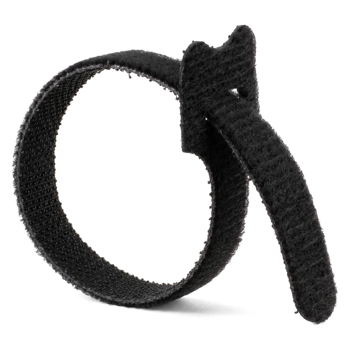 Black Magic reusable cable tie, looped and secured, showing its soft fabric hook-and-loop fastening.