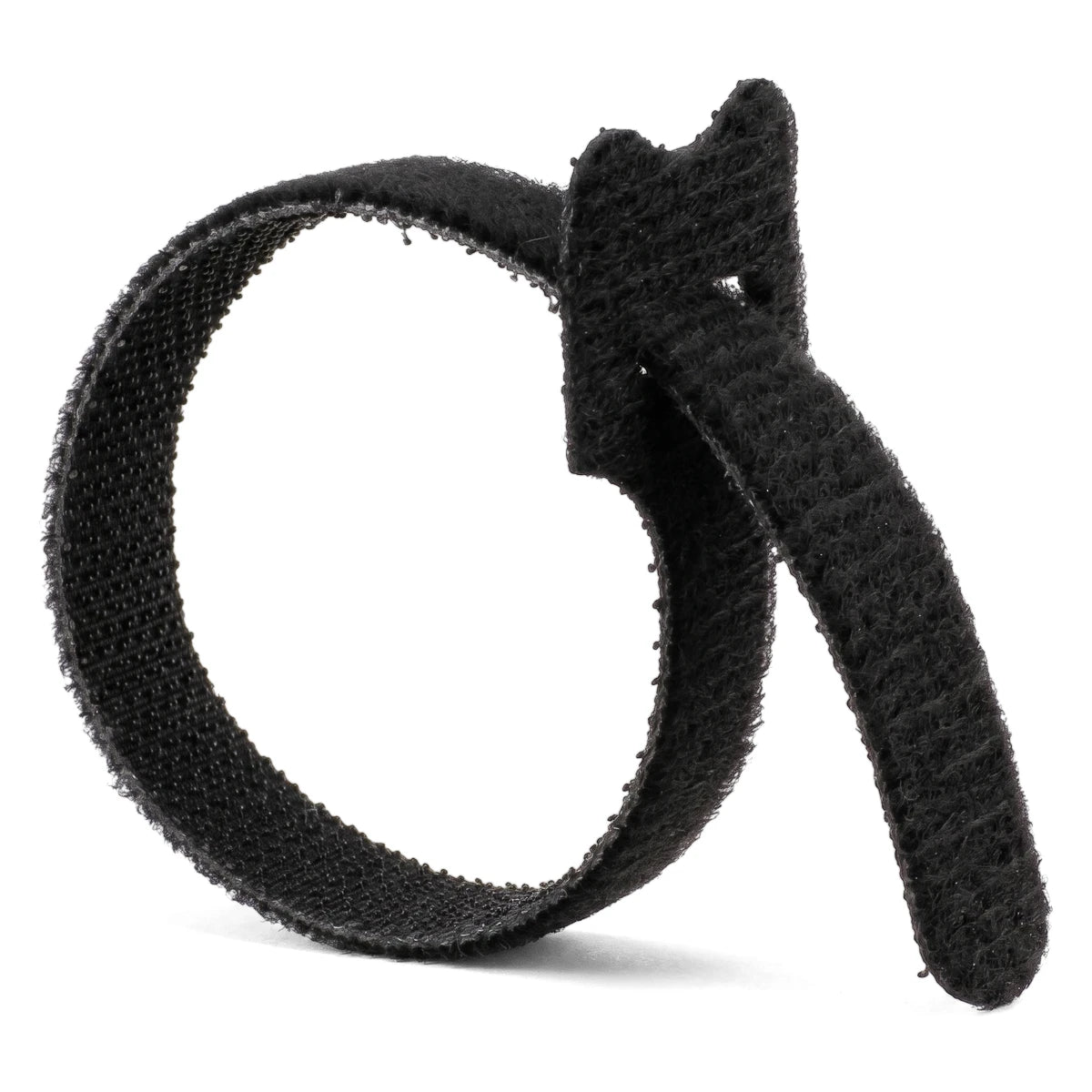 Black reusable cable tie in a curled loop, featuring a hook-and-loop texture for secure cable management.