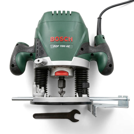 Bosch POF 1100 AE 1100W Electric Plunge Router Kit, green and silver, shown with a wrench and guide accessories.
