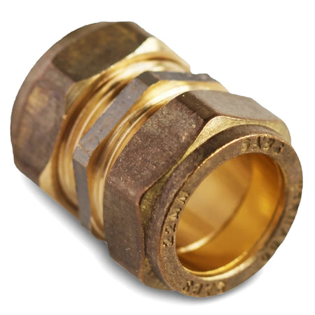 A brass 22mm straight CXC compression coupler, a plumbing fitting used to connect two pipes, on a white background.