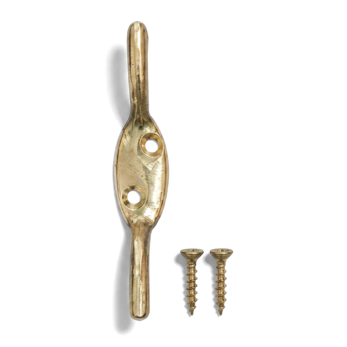Polished brass cleat hook with two accompanying mounting screws, presented vertically on a clean white background.