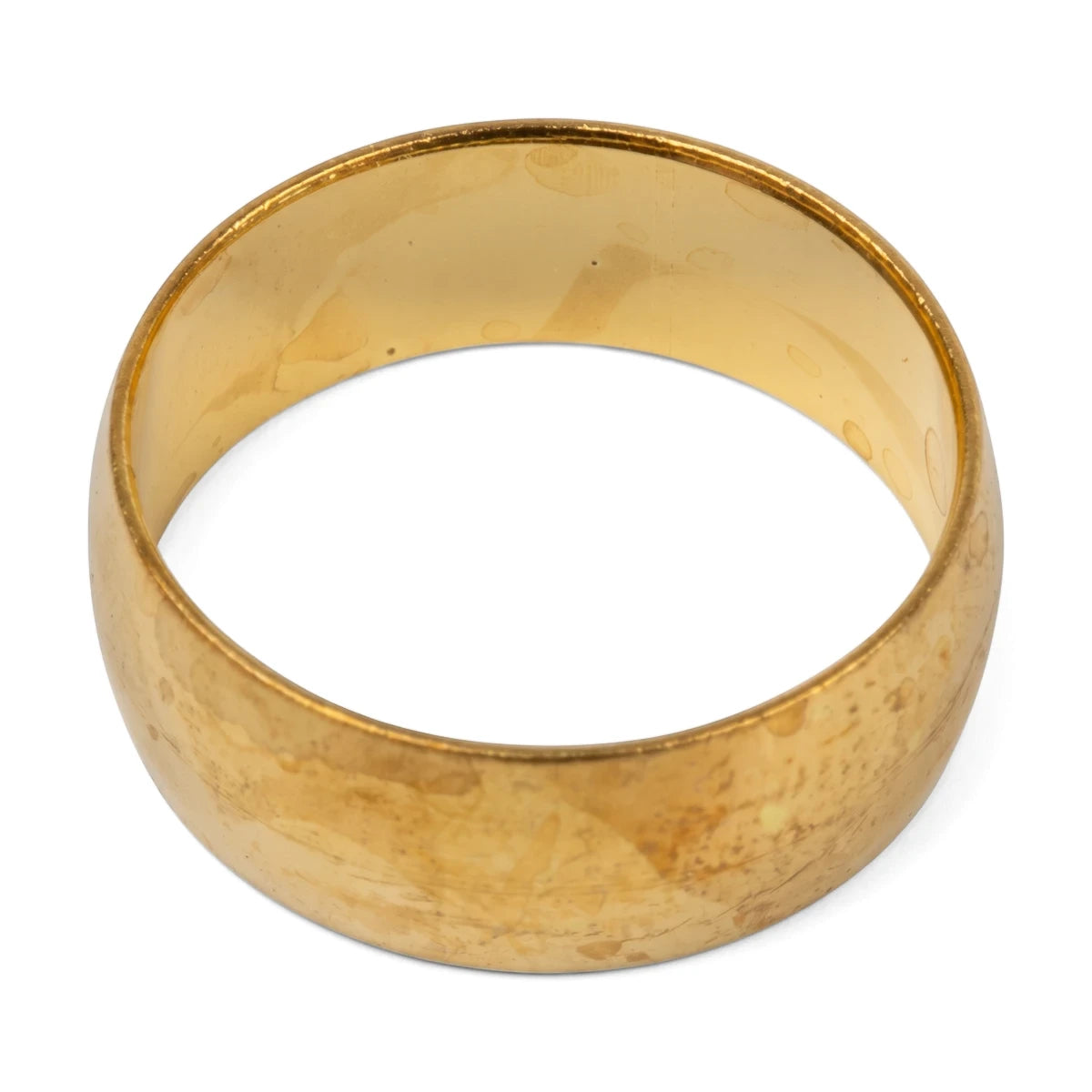 A gold-colored brass compression ring, circular in shape with a slightly worn texture, presented on a white background.
