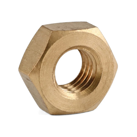 Close-up of a single brass hexagonal nut with internal threading, presented on a white background, useful for various