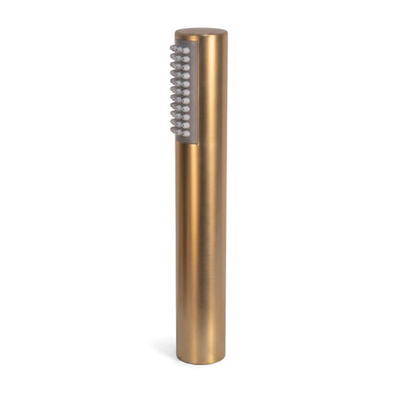 Brushed brass cylindrical hand shower set with multiple white nozzles on a flat panel, displayed upright.