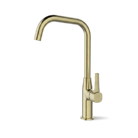A brushed brass deck mount ceiling mixer kitchen faucet features a high arching spout and a single lever handle on the right