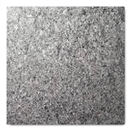Close-up of a grey charcoal ceramic Ceaser Stone floor tile, 50x50cm, with a speckled, textured surface pattern.