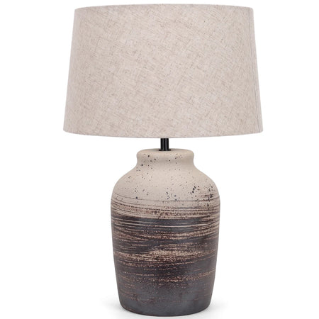 Ceramic base table lamp with a light beige hessian fabric shade and two-tone speckled base. Front view.