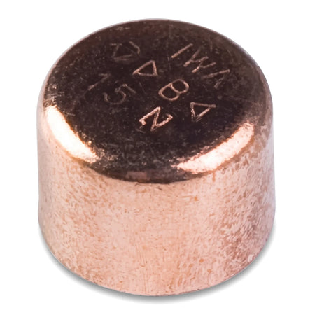 A close-up view of a shiny copper 15mm stopend plumbing fitting, featuring clear technical markings inscribed on its flat
