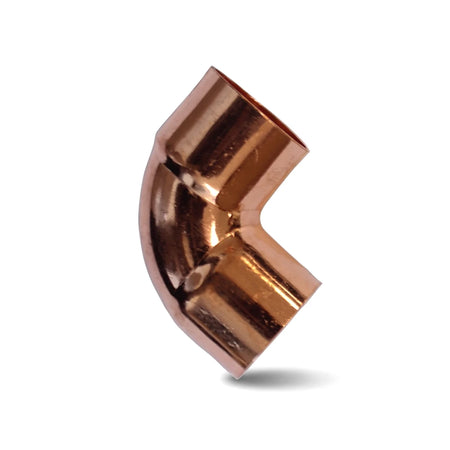 A shiny copper 90-degree pipe elbow fitting for plumbing, shown with its angled bend on a white background.
