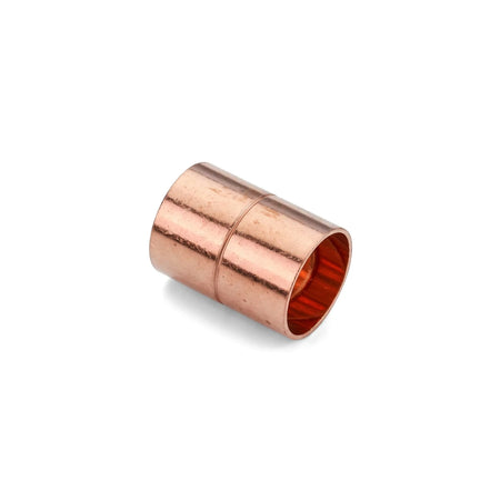Copper CXC coupler, a cylindrical plumbing fitting, shown at an angle on a white background.