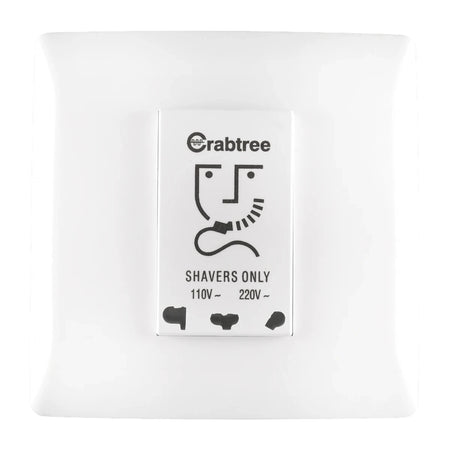 White Crabtree shaver socket, 220V/110V, featuring a distinctive logo and multiple outlet types for shavers.