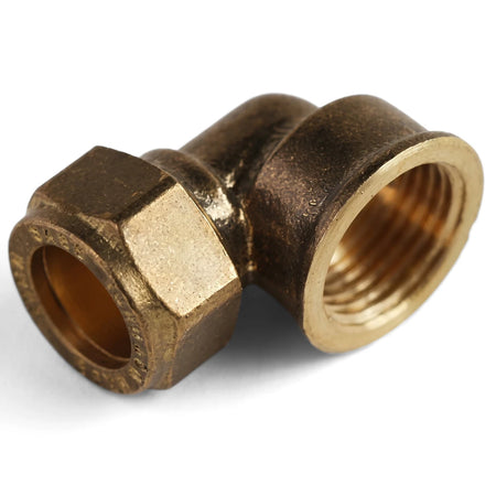 CXFI Elbow, a shiny brass 90-degree plumbing fitting with a compression nut and threaded end, viewed from an angle.