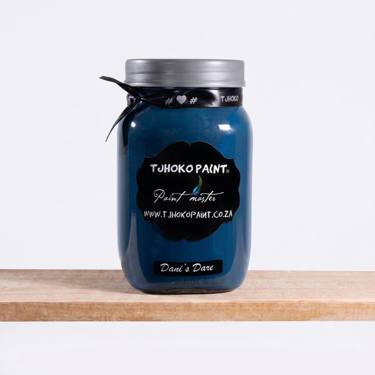 Dani's Dare 500ml Chalk Paint in a deep blue hue, presented in a clear glass jar with a silver lid.