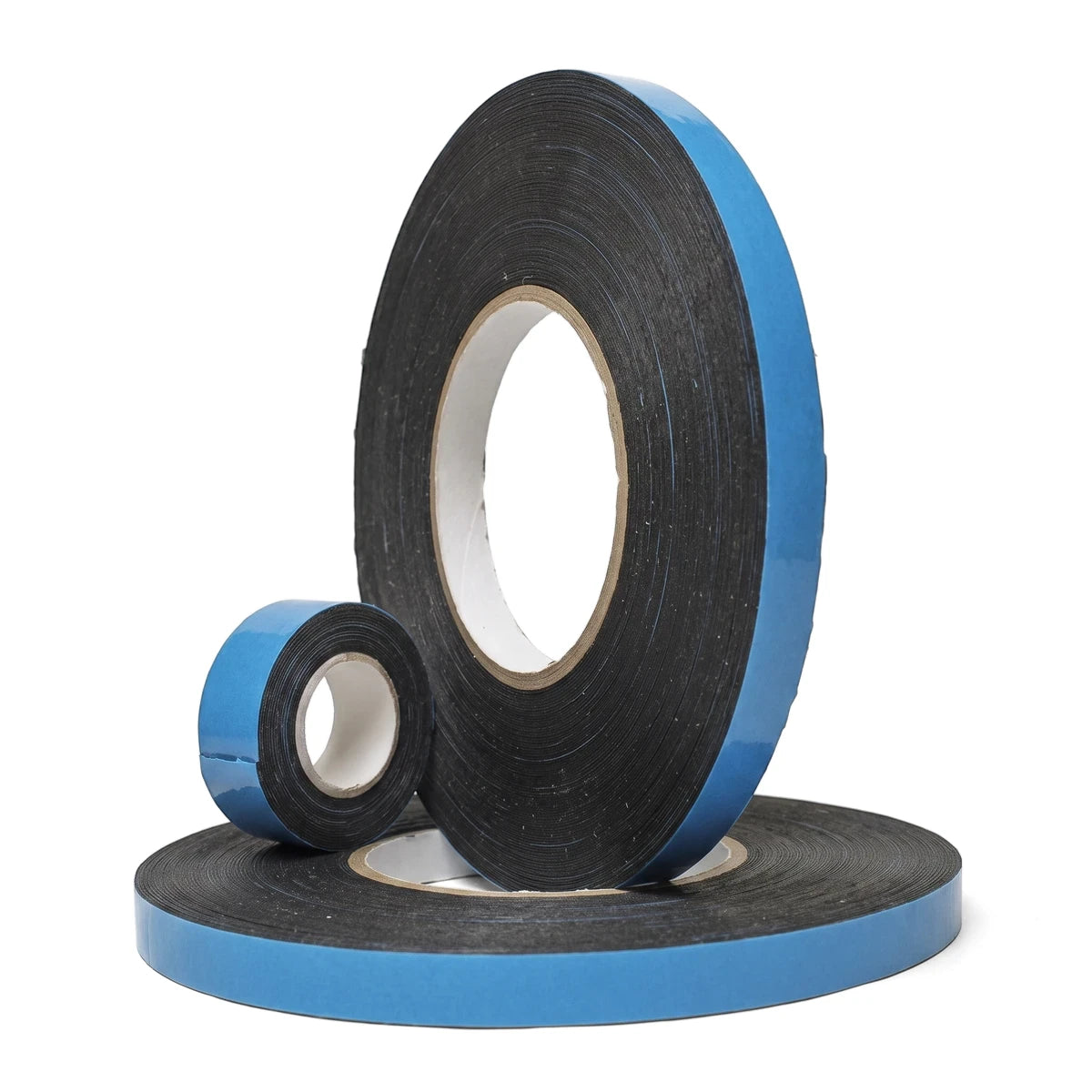 Three rolls of black double-sided foam tape with blue release liner, varying in size, stacked on a white background.
