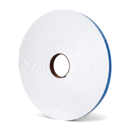 Large white roll of double-sided tape with a brown core and blue protective edge, visible from a slight angle.