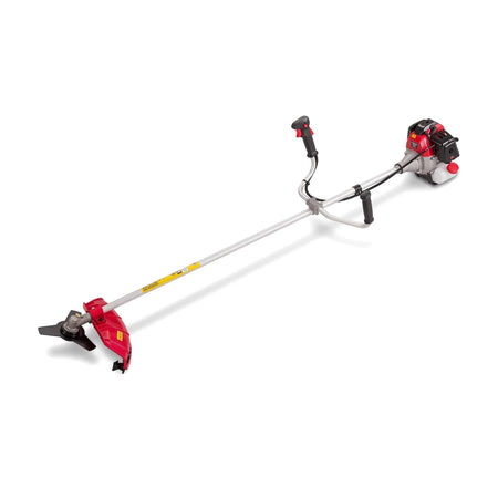 Red and black Dual-Function Petrol Brush Cutter 2Hp - 52Cc, angled view, showing the long shaft and engine.