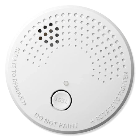 White circular Fa-Sa002 5 Year Battery Smoke Alarm with a central test button and hexagonal ventilation on a clean