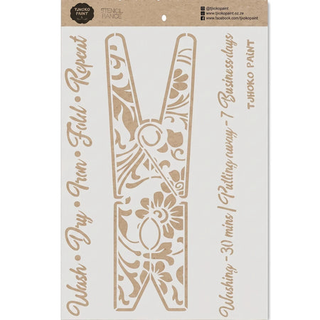 A beige paint stencil featuring a large decorative clothes pin design with intricate floral patterns, presented flat-lay.