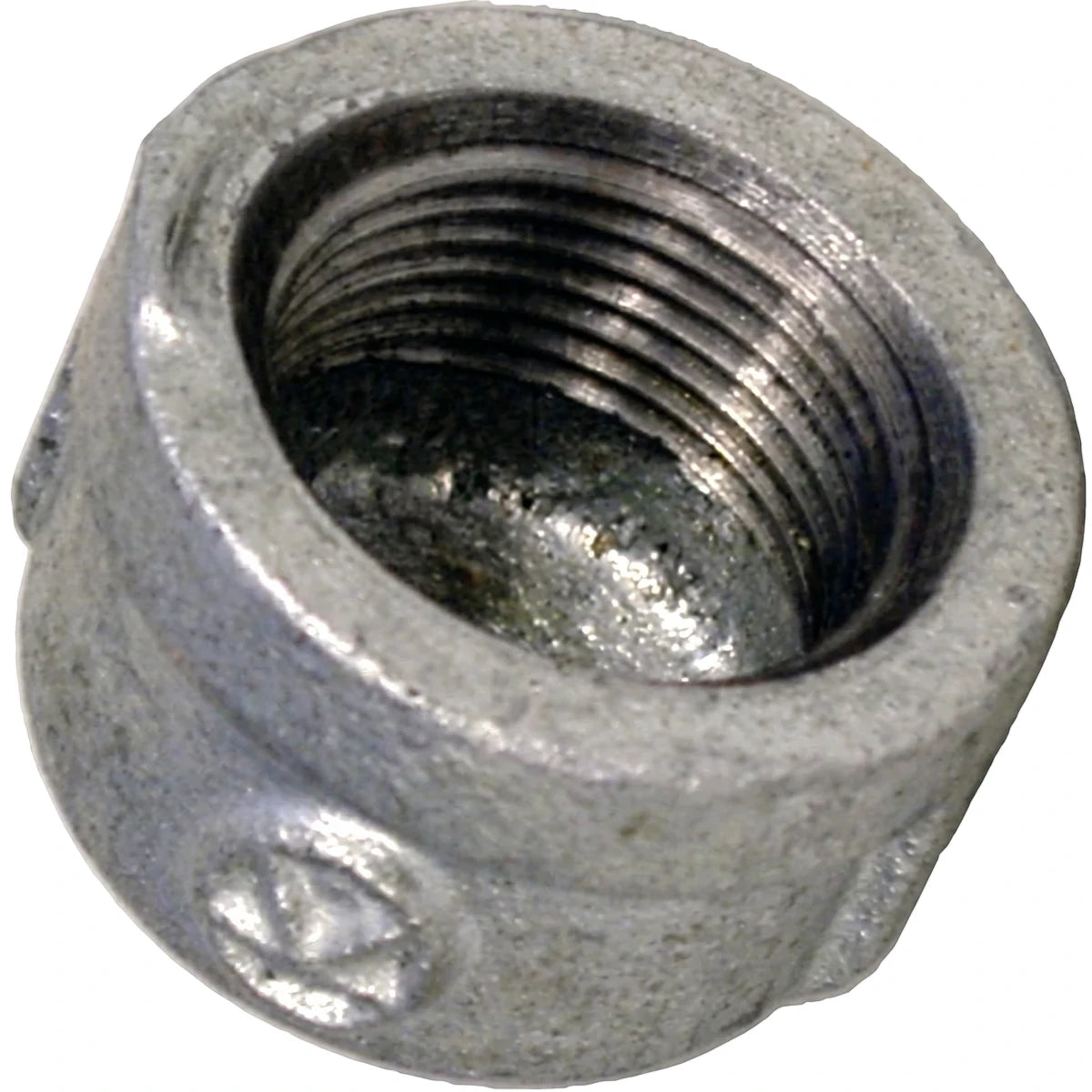 Galvanized 1/2 inch pipe cap with internal threading, viewed from an angled top perspective, industrial silver finish.