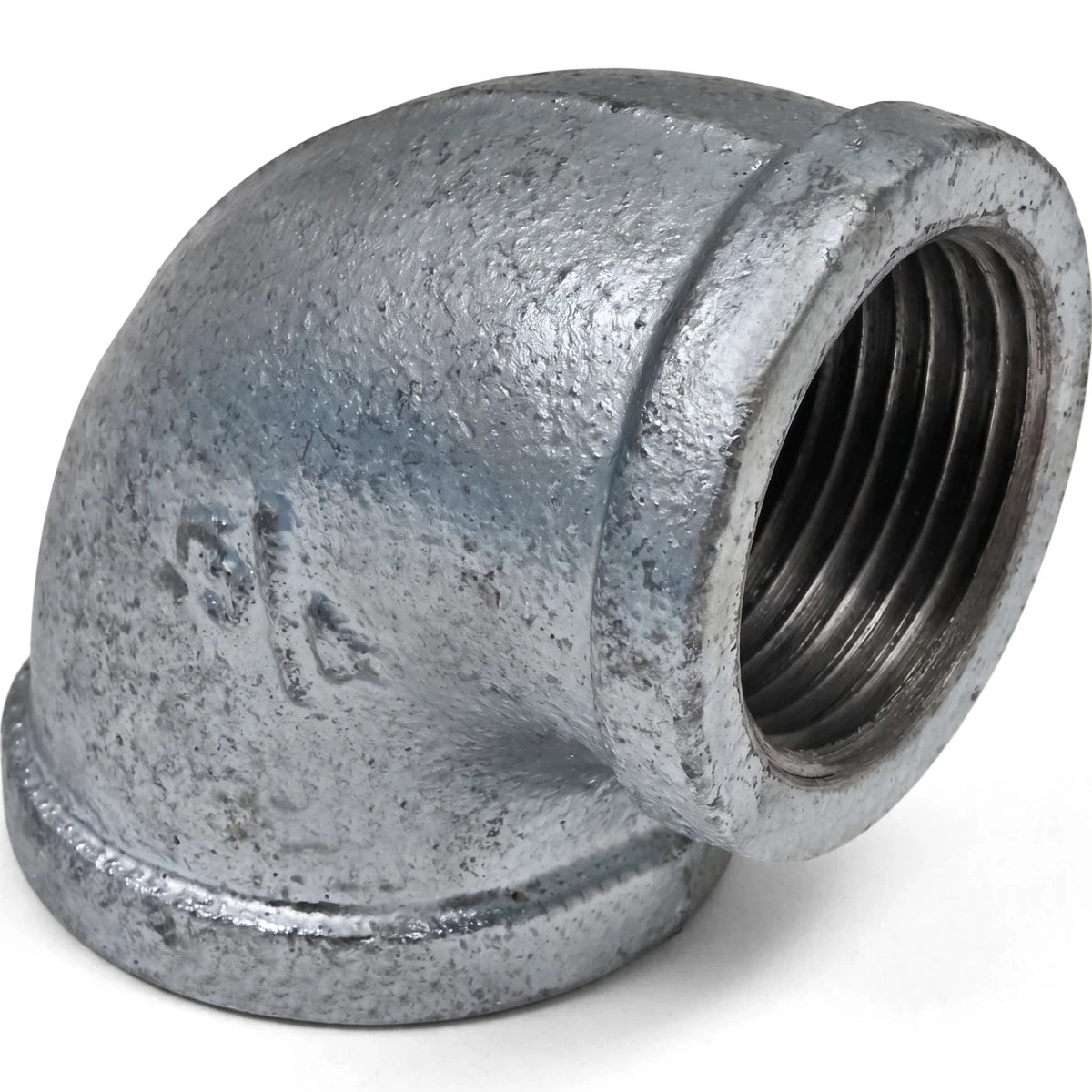 Close-up of a galvanized 90-degree female x female elbow, 3/4 inch, showing threaded ends and textured metallic surface.