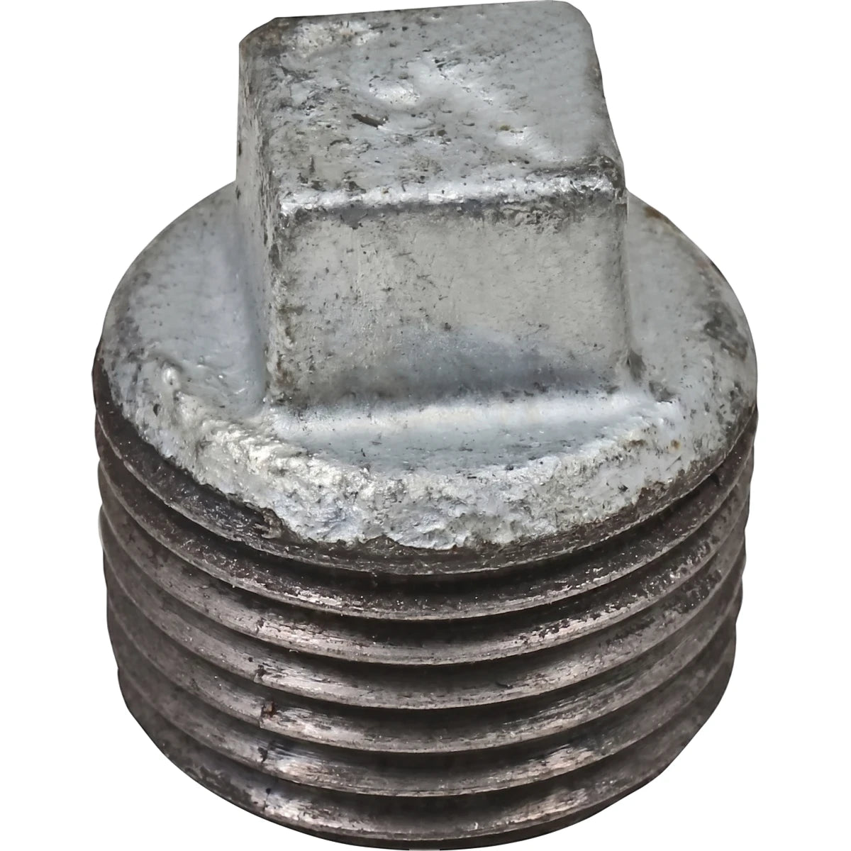 Close-up view of a metal galvanized plug with a threaded body and square drive head, suitable for plumbing.
