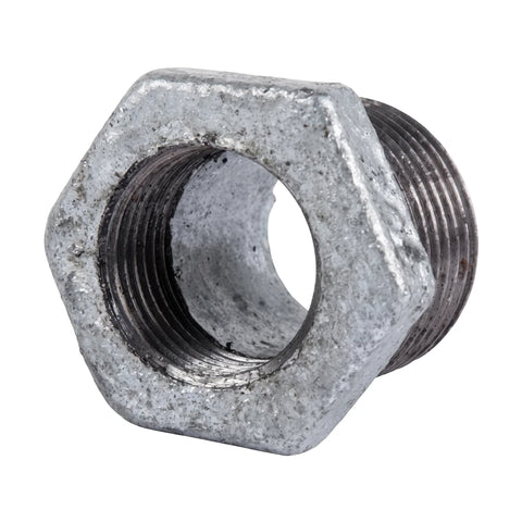A hexagonal galvanized reducing bush with visible threading on both ends, shown from a slight angle, metallic gray in color,
