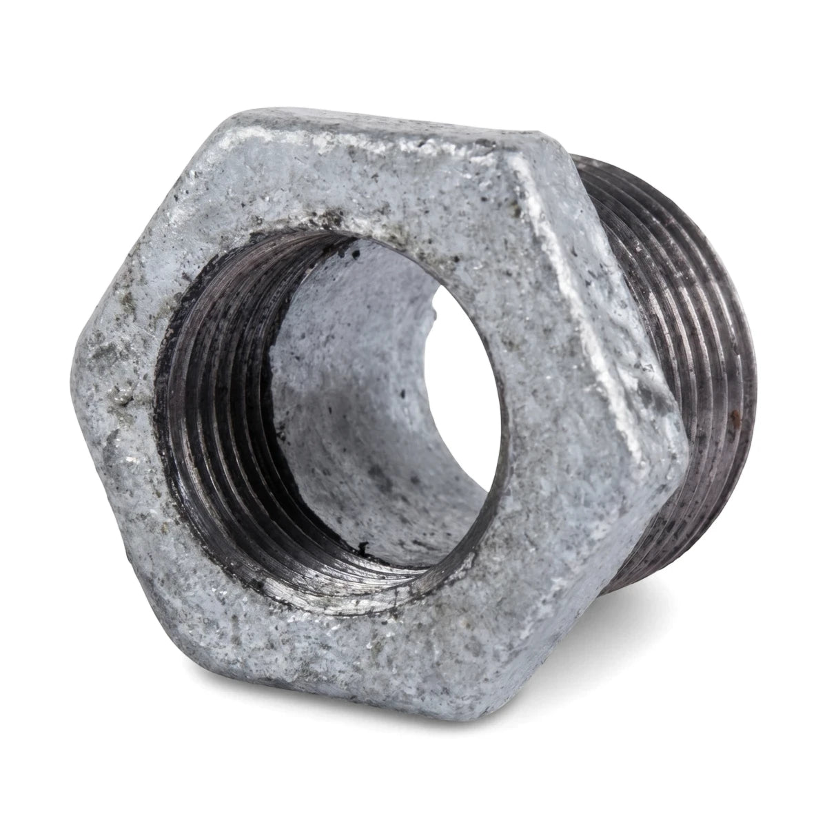 Close-up view of a galvanized reducing bush, male 2 inch by female 1 inch, used for plumbing connections, featuring external