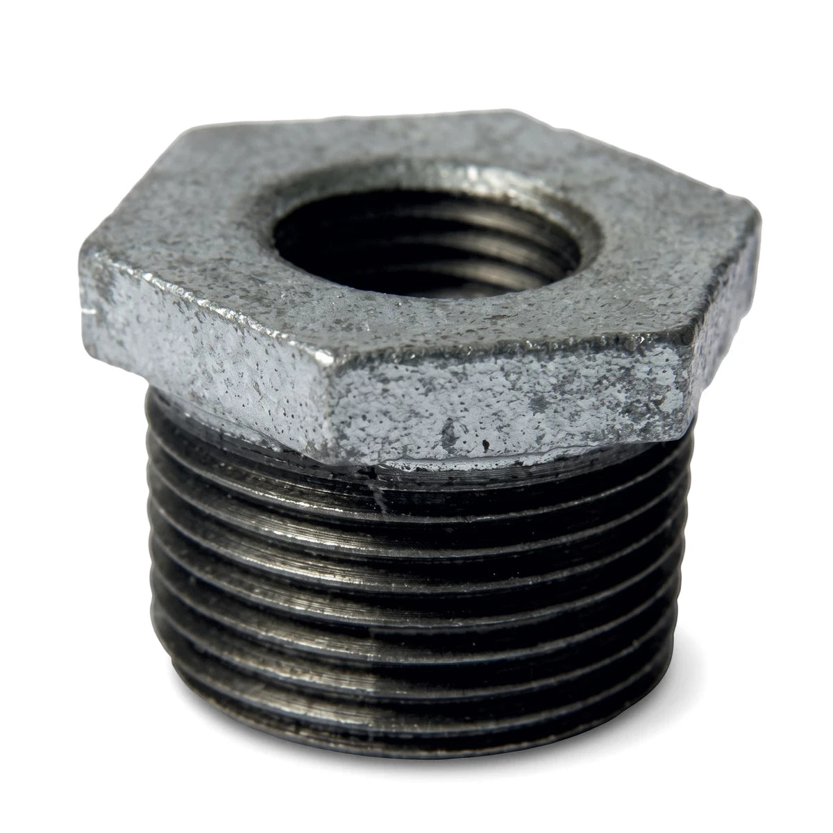 Galvanized reducing bush, metal, with hexagonal head and threaded exterior for plumbing connections.