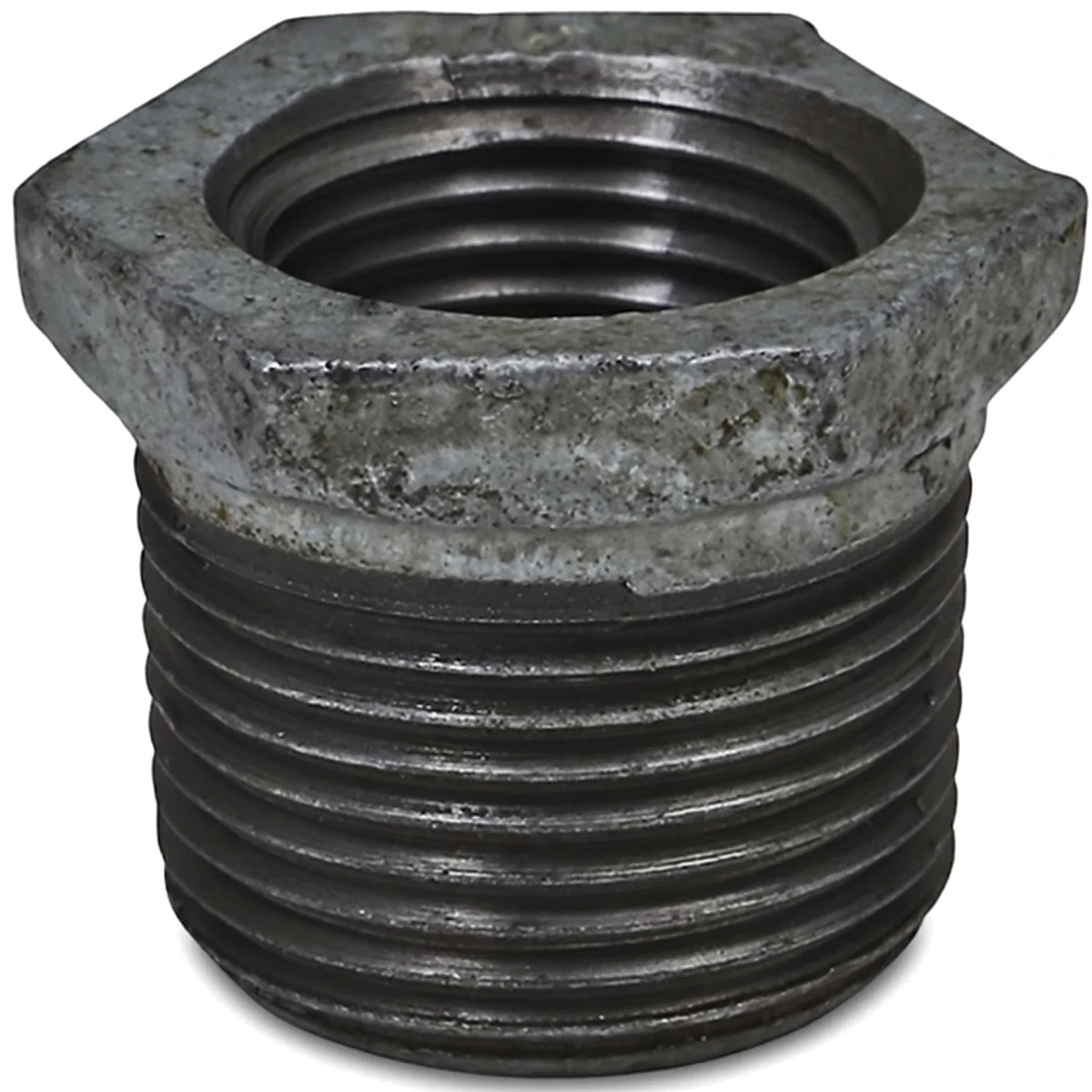 Galvanized reducing bushing, male to female, with external and internal threads and a hexagonal head for pipe connections.