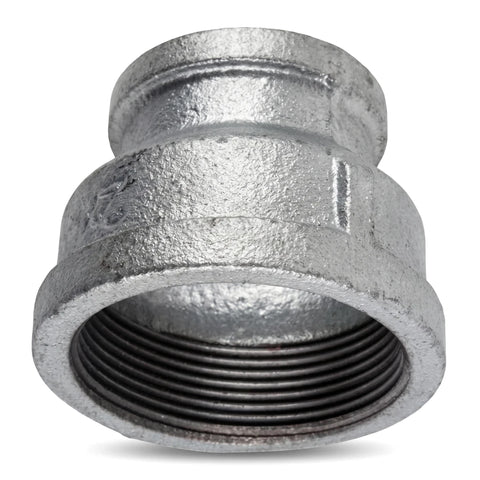 Galvanized reducing socket with 1 1/2 by 3/4 inch threaded ends, shown in an angled close-up view.