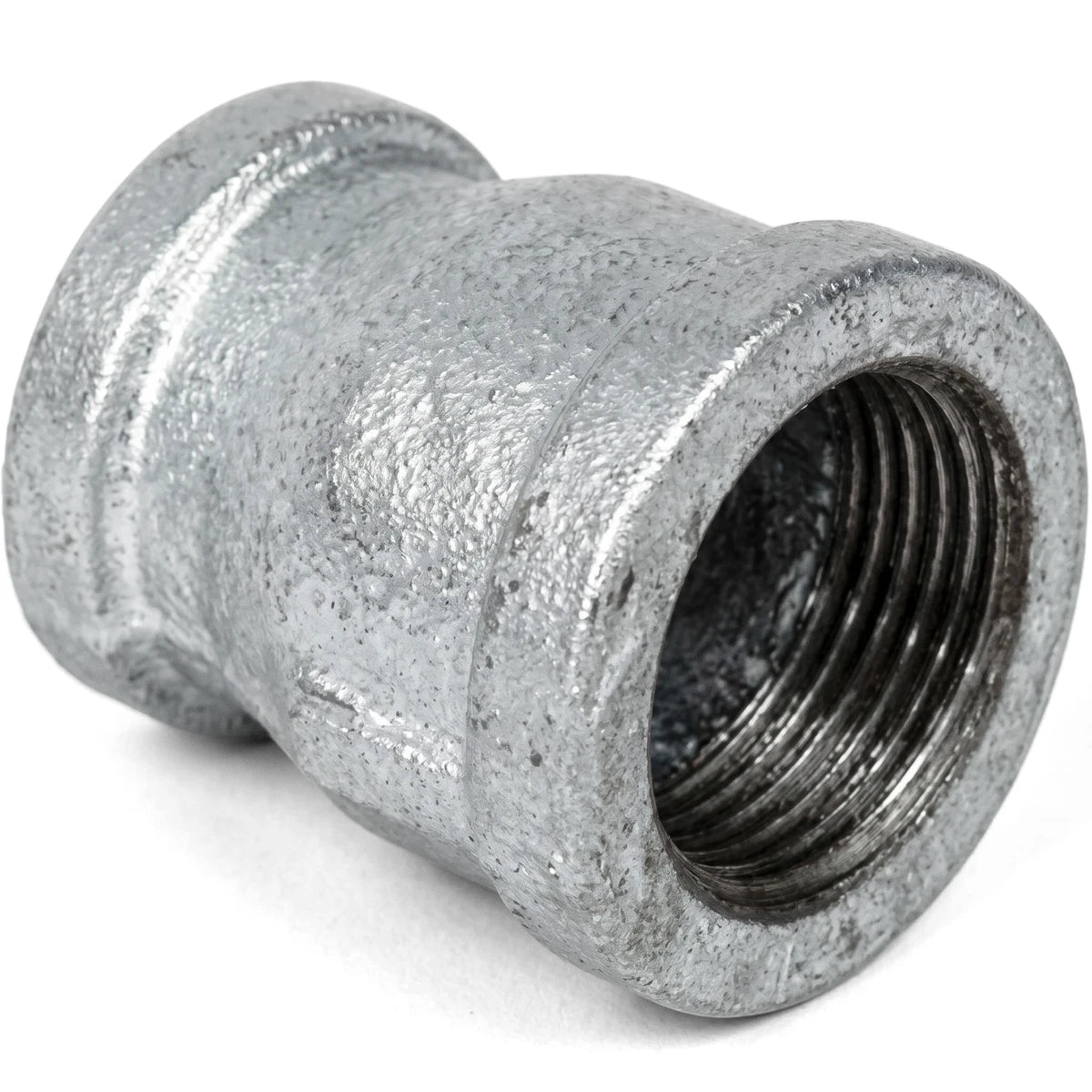 Galvanized reducing socket, 1 by 3/4 inch, a metal pipe fitting with a threaded interior.