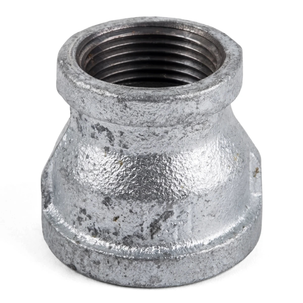 Galvanized reducing socket, a silver metal pipe fitting with internal threads, for plumbing and industrial use.