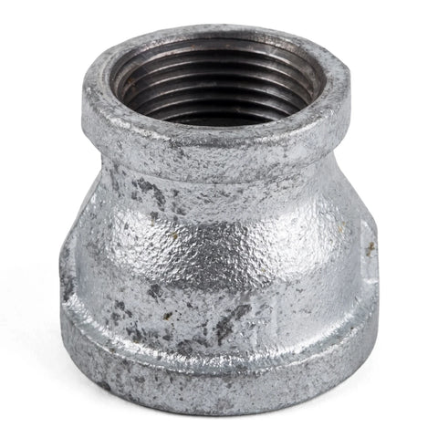 Galvanized reducing socket, a silver metal pipe fitting with internal threads, for plumbing and industrial use.
